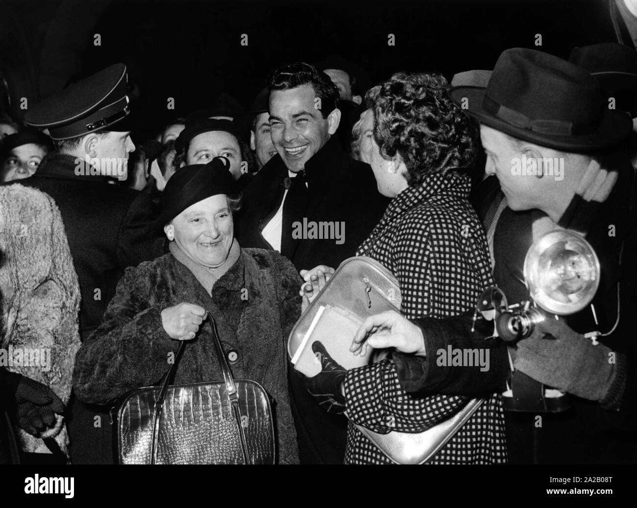 The Austrian actor Adrian Hoven amidst fans. Undated photo, presumably from around the year 1960. Stock Photo