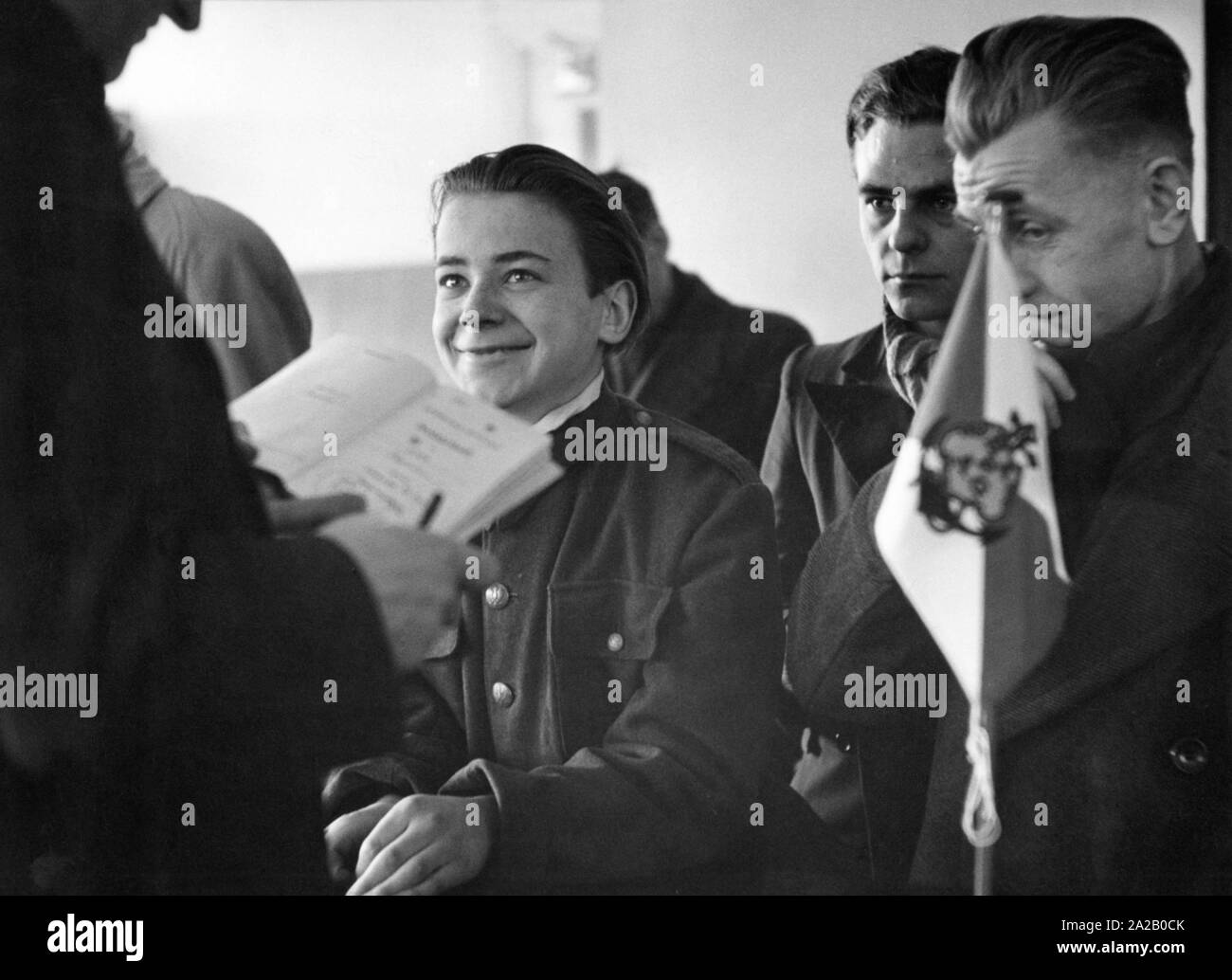A 16-year-old boy from Hamburg is happy about being employed as cabin boy at HAPAG. Stock Photo