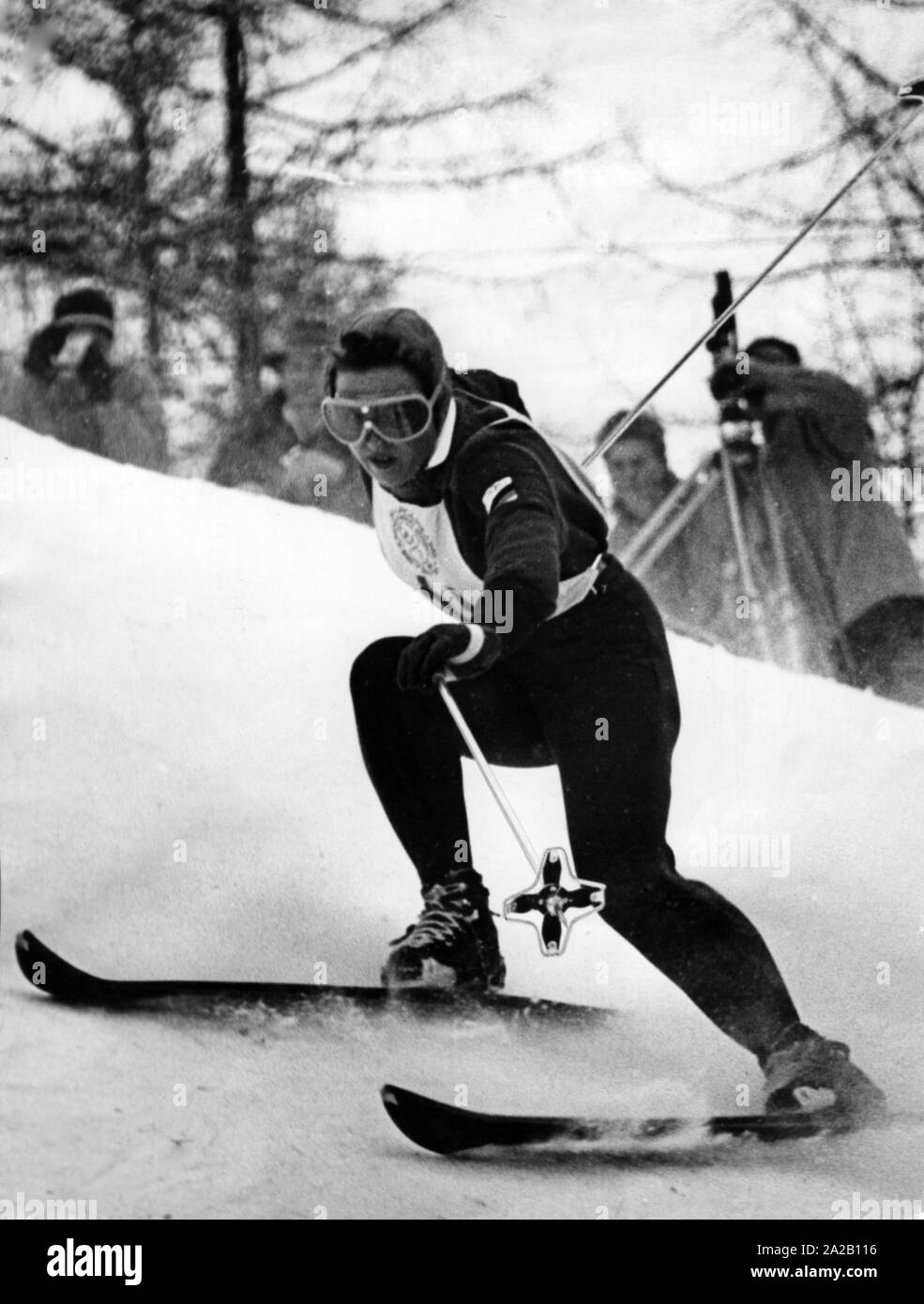 The ski racer Rosa (called: 'Ossi') Reichert participated in the German selection for the Olympic Games in Cortina d'Ampezzo. The picture shows her during a competition. She is probably participating in the giant slalom, which she finished as fastest and thus won the gold medal. Stock Photo