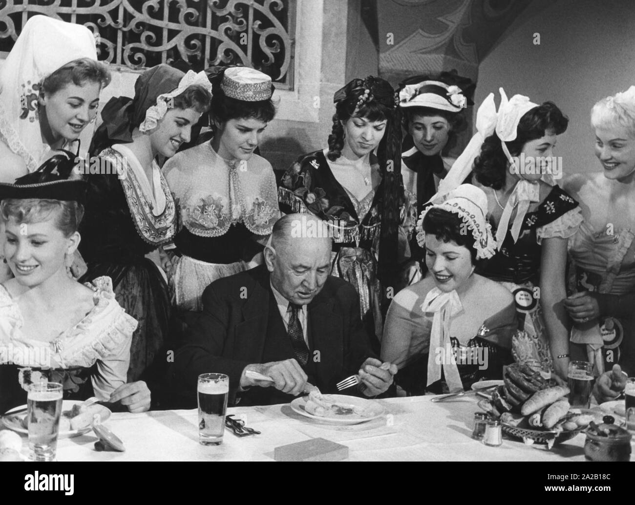 The Mayor of Munich Thomas Wimmer at the Weisswurstessen with applicants of the Miss Germany election. Stock Photo