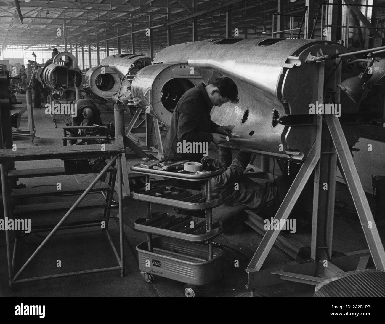 Workers at MBB (Messerschmitt-Boelkow-Blohm) Munich manufacturing aircrafts of the type Fouga Magister for the Bundeswehr. Stock Photo