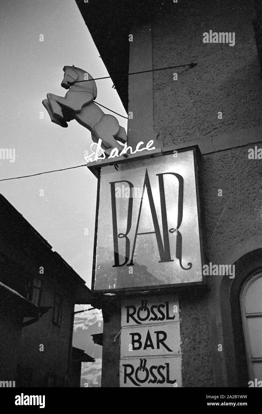 View of the entrance area of the dance bar 'Roessl' in the center of Kitzbuehel. The image was taken at the time when the Hahnenkamm race took place at Kitzbuehel. Stock Photo