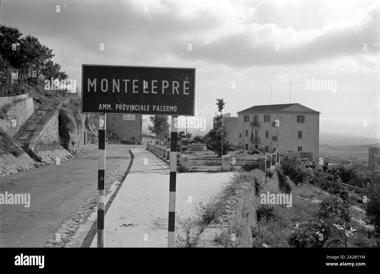 View of the town sign of Montelepre in the province of Palermo (region of Sicily). It is 26km away from the city of Palermo. Former Sicilian folk hero Salvatore Giuliano was born in Montelepre in 1922, and he is buried in the Ostfriedhof (Eastern cemetery) of the city. The inhabitants of Montelepre make a living mainly from farming. Stock Photo