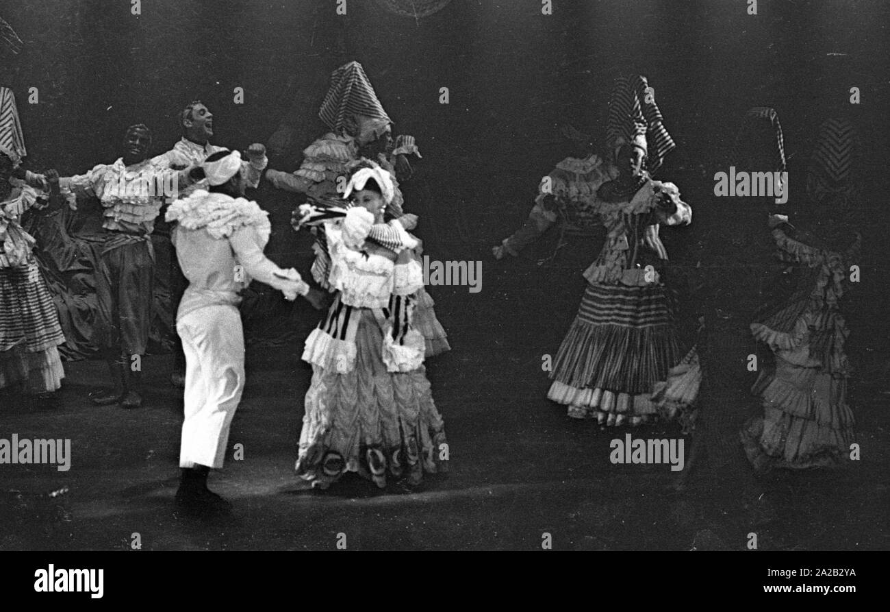 Performance of the dancer and choreographer Katherine Dunham and her dance troupe in Munich. In May 1954 she was on tour with the program 'Caribbean Rhapsody' in 6 German cities. The costumes and decoration were the responsibility of her husband John Pratt. Dunham was one of the most famous dance teachers and choreographers in the US, beside that she was a PhD anthropologist, civil rights activist and author. Stock Photo