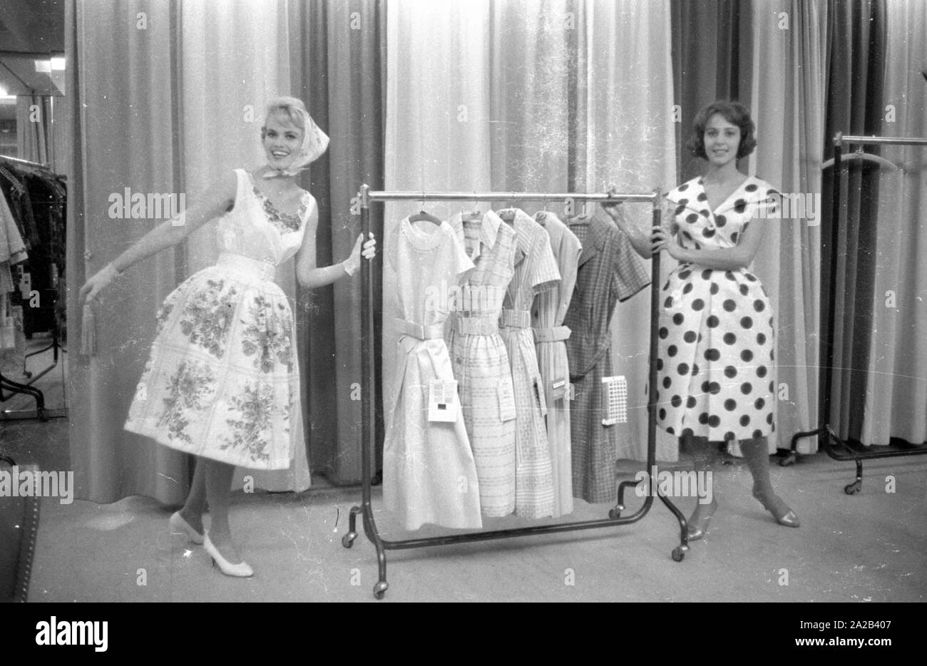 Two models present new clothes from a designer. The picture was taken at one of the presentations of the 'Berliner Durchreise', the oldest fashion fair in the world. This trade fair is held every six months at various locations in Berlin for trade professionals and buyers. Stock Photo