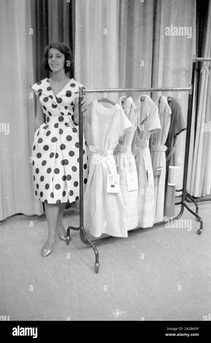 The picture shows a model at the presentation of a new dress of a designer. The picture was taken at one of the presentations of the 'Berliner Durchreise', the oldest fashion fair in the world. This trade fair is held every six months at various locations in Berlin for trade professionals and buyers. Stock Photo