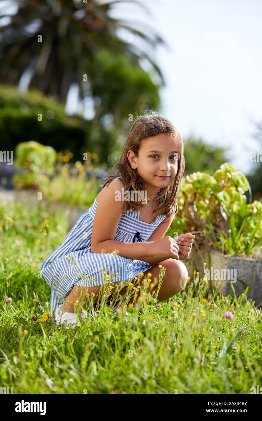 Portrait of young girl looking at camera, Getaria, Gipuzkoa, Basque Country, Spain Stock Photo