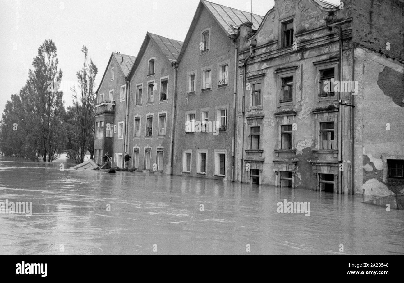 The flood in Passau and other parts of Lower Bavaria (July, 1954) were also referred to as the flood of the century. The Danube, the Inn and the Ilz had overflowed their banks, and flooded towns and villages.  Photo of the flooded streets in the historic city of Passau. Stock Photo