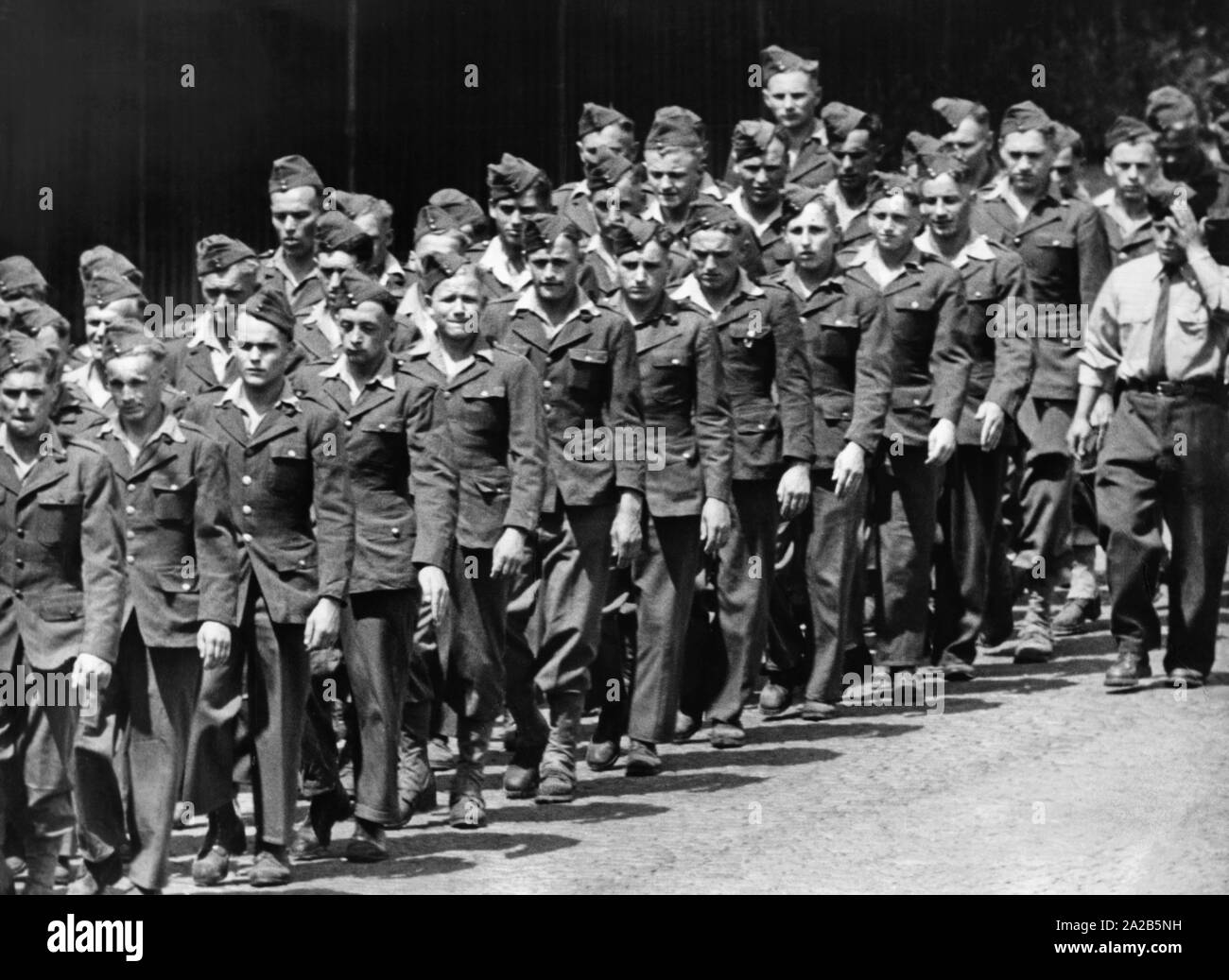 German Foreign Legionnaires of the French Foreign Legion march in a row in Offenburg. Stock Photo