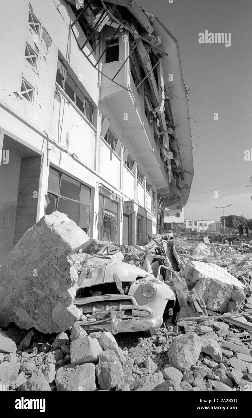 A car buried under rubble. From the report "Earthquake in Agadir". The