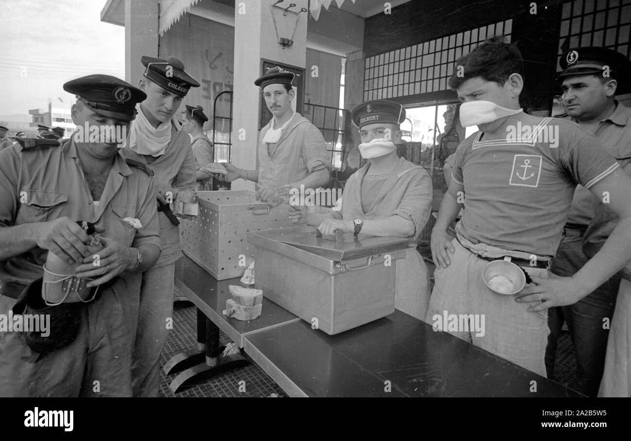 Crew members of the French warship 'Colbert' prepare a food distribution. From the report 'Earthquake in Agadir'. The 1960 Agadir earthquake destroyed almost the entire city and is considered the most serious natural disaster in the history of Morocco. Stock Photo