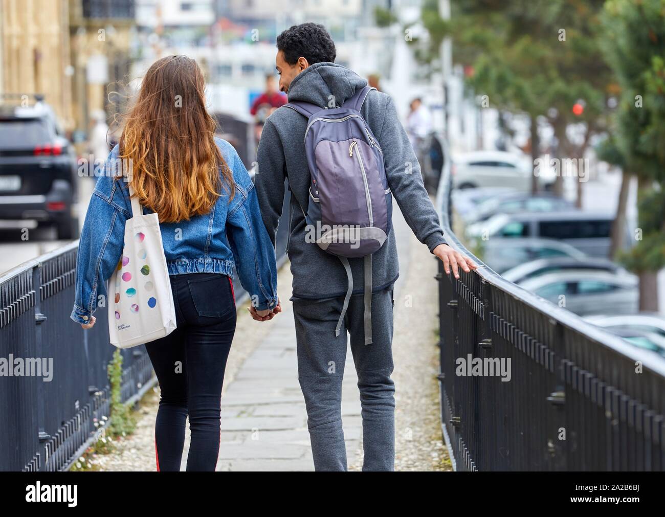 Couple of tourists visiting the city, Multiracial young couple, Donostia, San Sebastian, Gipuzkoa, Basque Country, Spain Stock Photo