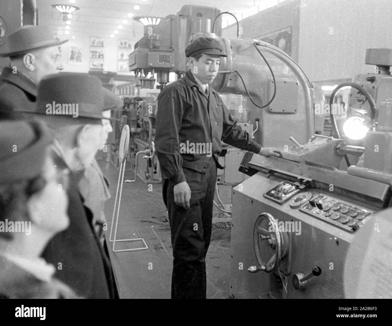 The city during the Spring Fair 1960, a man presents a machine. Stock Photo