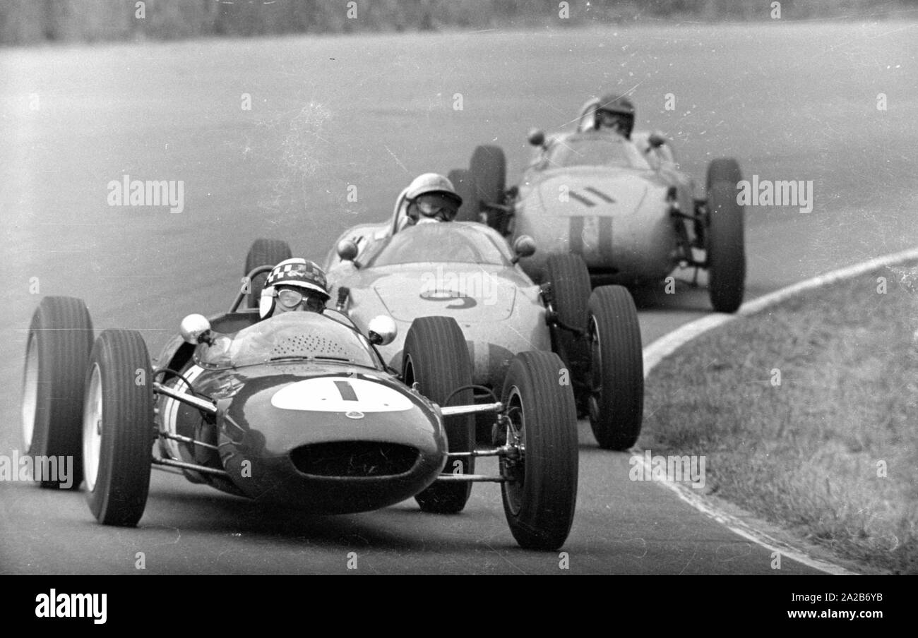 10th Grand Prix of the Solitude 1961. Innes Ireland in the Lotus 21 (Car Number 1) is followed by Jo Bonnier (Car Number 9) and Dan Gurney (Car Number 11), both in a Porsche 718. The Solitude Grand Prix was a Formula 1 race apart from the world championship ranking. It took place during the motorcycle races on the Solitude race track near Stuttgart. Stock Photo