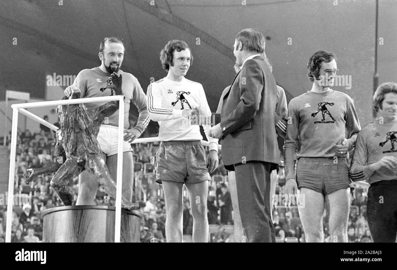 Munich Mayor Georg Kronawitter (3rd from the left) congratulates footballer Franz Beckenbauer (2nd from the left) for the second place at the Sports Press Festival in the Munich Olympiahalle. The winner was the athlete Klaus Wolfermann (1st from left). Stock Photo