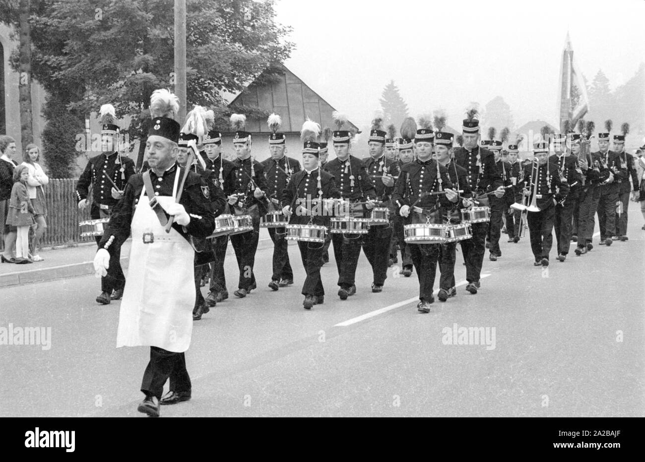 Marching band with marching drums in a traditional costume parade in Bavaria. Stock Photo