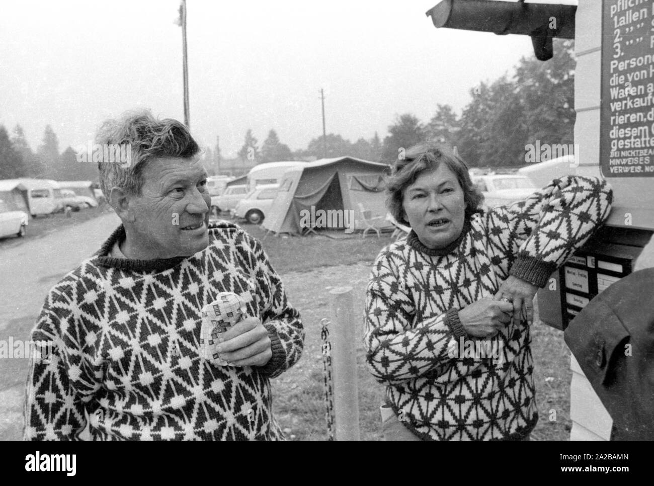 A couple in matching outfits on a camping holiday in Bavaria. Stock Photo