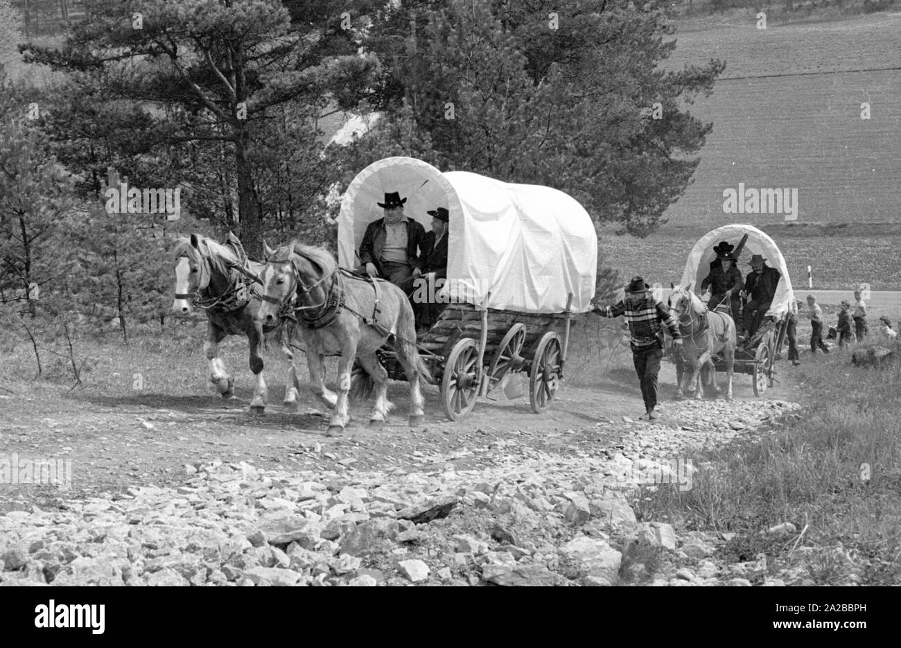 Adventure holiday with covered wagon in Upper Franconia: it must be pushed uphill. Stock Photo