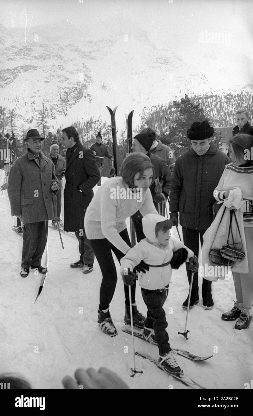 Farah Diba (center), the wife of the Iranian Shah Mohammad Reza Pahlavi, with her daughter Farahnaz skiing in St. Moritz in 1968. Stock Photo