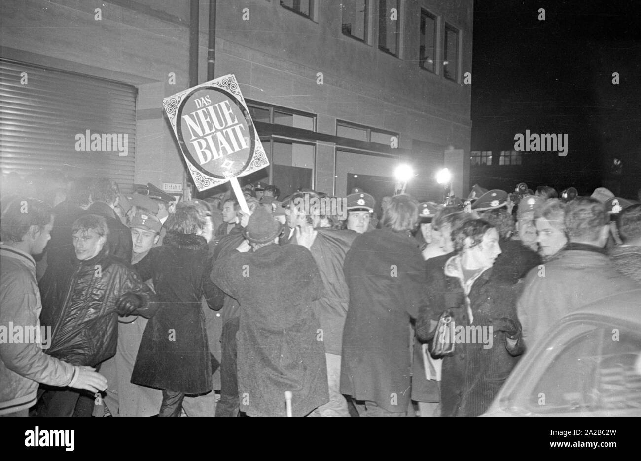 After the assassination attempt on Rudi Dutschke, actions took place against the Springer publishing house throughout Germany on the Easter weekend 1968. In Munich, demonstrators try to stop the delivery of the Bild-Zeitung through the barricade of the Munich bookshop on Schellingstrasse (either 12.04 or 15.04.).  Pictured: Melee between protesters and police. Stock Photo