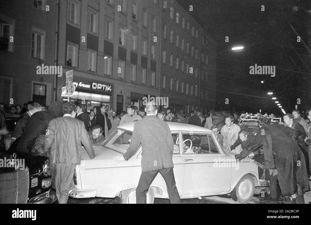 Following the assassination attempt on Rudi Dutschke, actions took place against the Springer publishing house throughout Germany on the Easter weekend 1968. In Munich, demonstrators try to stop the delivery of the Bild-Zeitung through the barricade of the Munich bookshop on Schellingstrasse (either 12.04 or 15.04.). Stock Photo