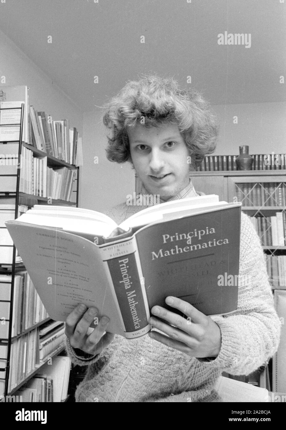Calculating miracle Elmar Eder (r.) with a mathematic book. Stock Photo