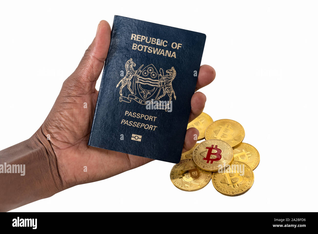 African woman hand holding a bitcoin and Botswana African passport