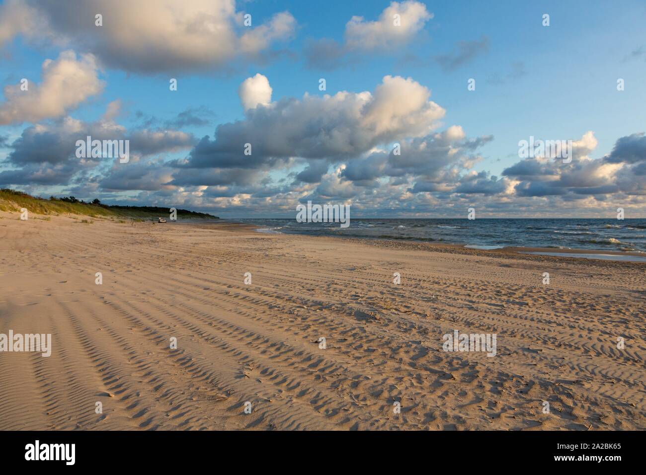 Baltic Sea beach with cloudy sky in summer sunset, Palanga, Lithuania