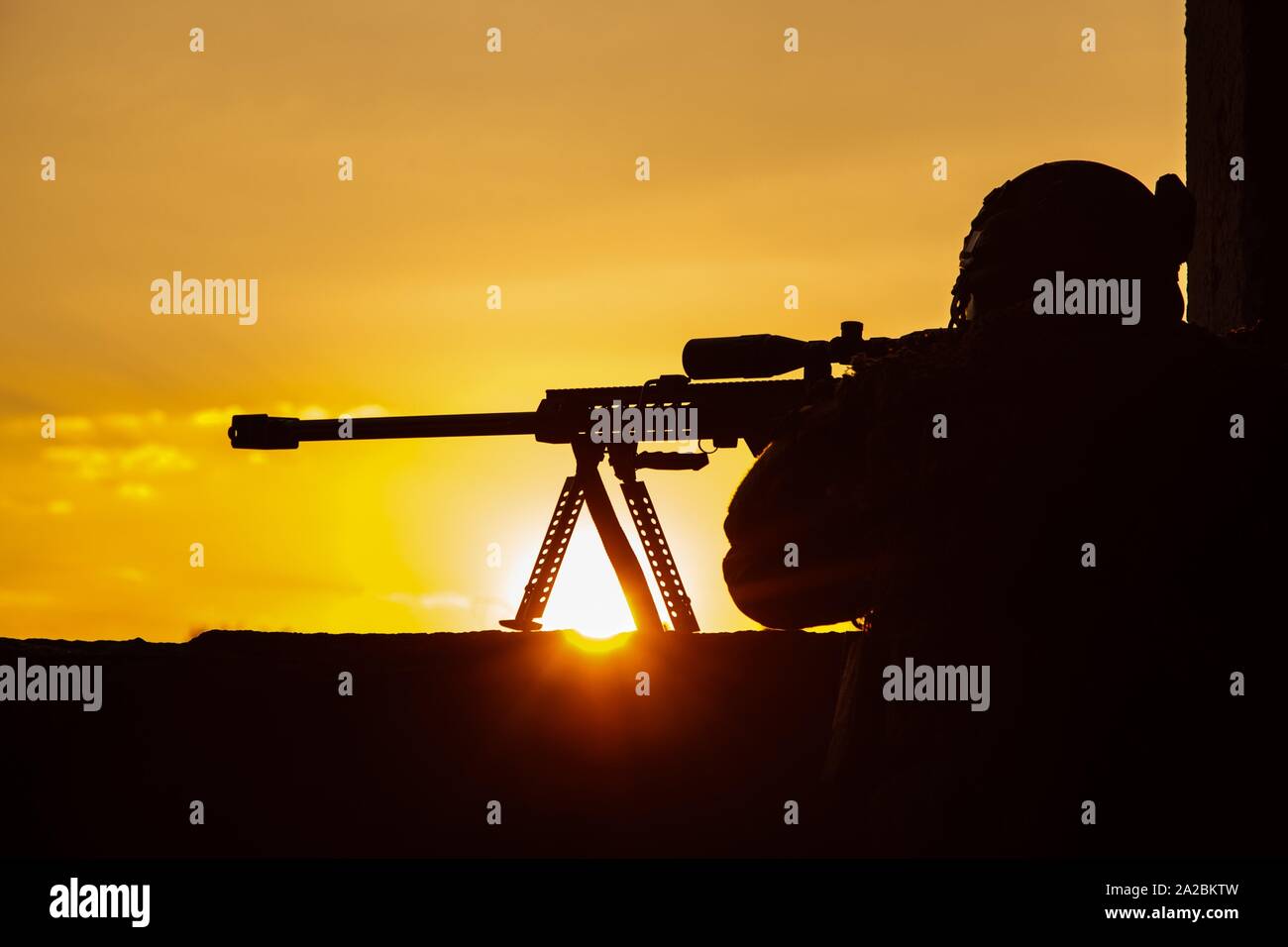 Army sniper with large-caliber sniper rifle seeking killing enemy ...