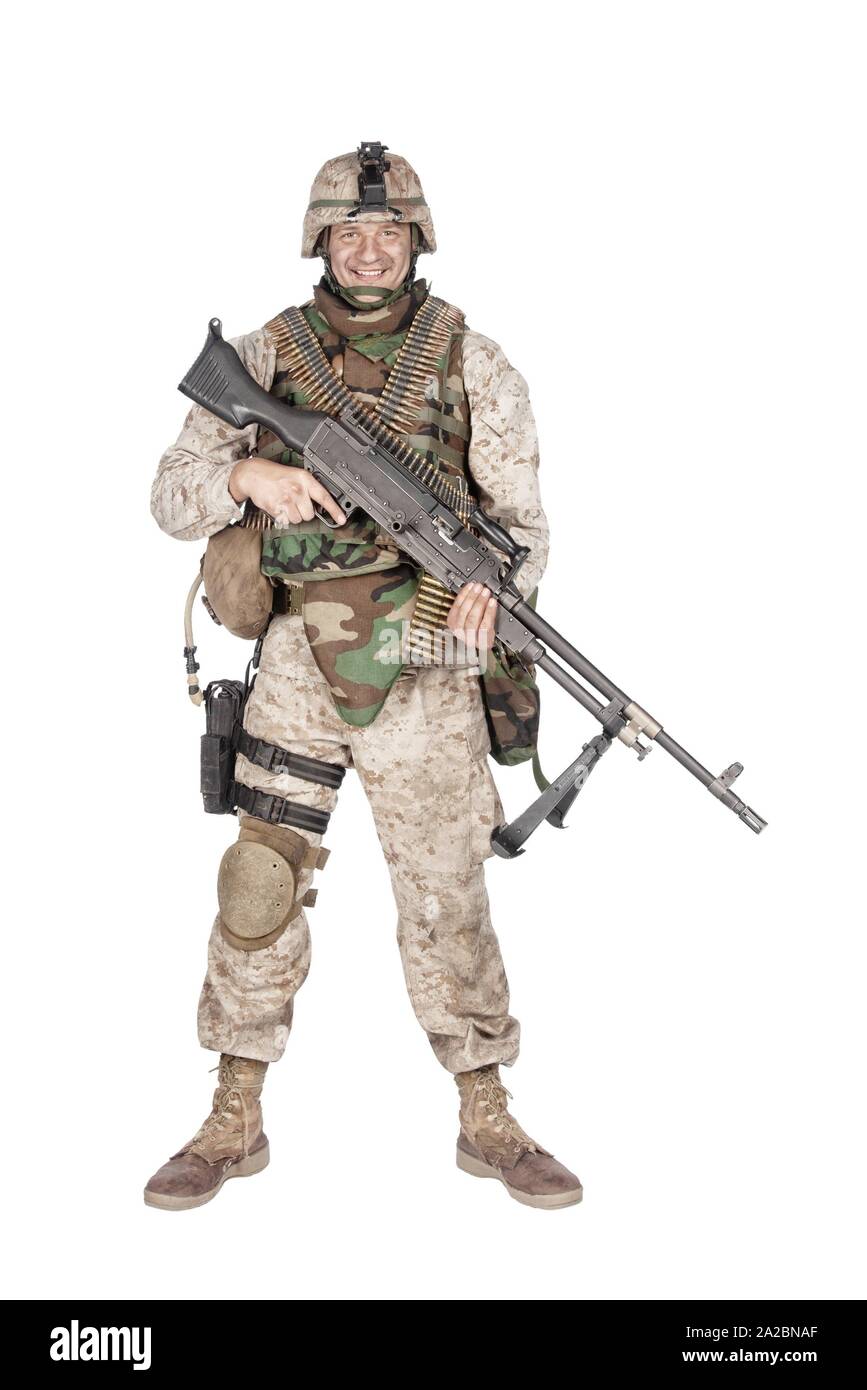 Studio shoot of army, marine machine gunner in camouflage combat uniform  and body armor, standing with machine gun, isolated on white Stock Photo -  Alamy