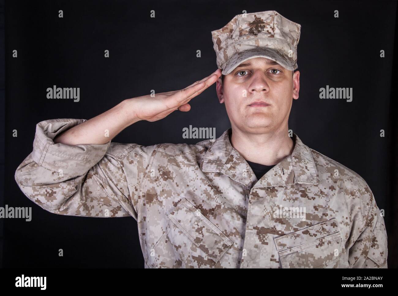 Shoulder portrait of saluting United States Marine Corps infantry