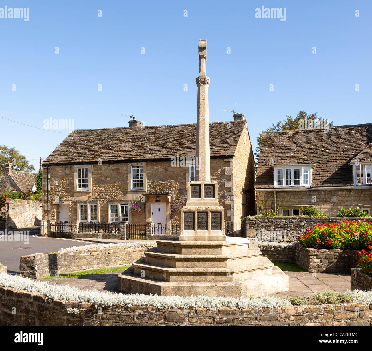 Historic Cotswold stone buildings and war memorial in Canon Square, Melksham, Wiltshire, England 