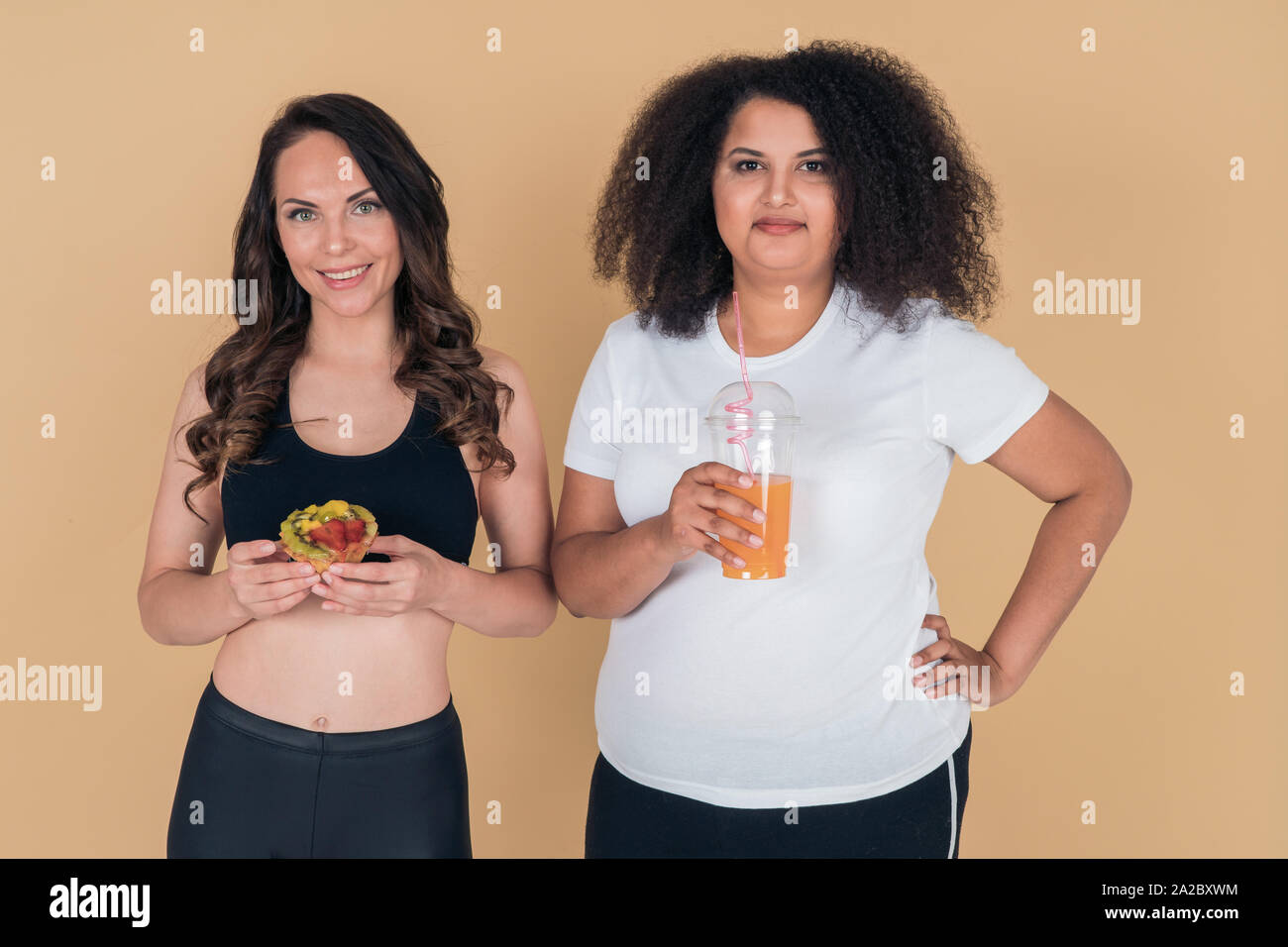 A Contented Athletic Skinny Girl Is Holding A Fruit Cake A Contented Athletic Skinny Girl Is Holding A Fruit Cake