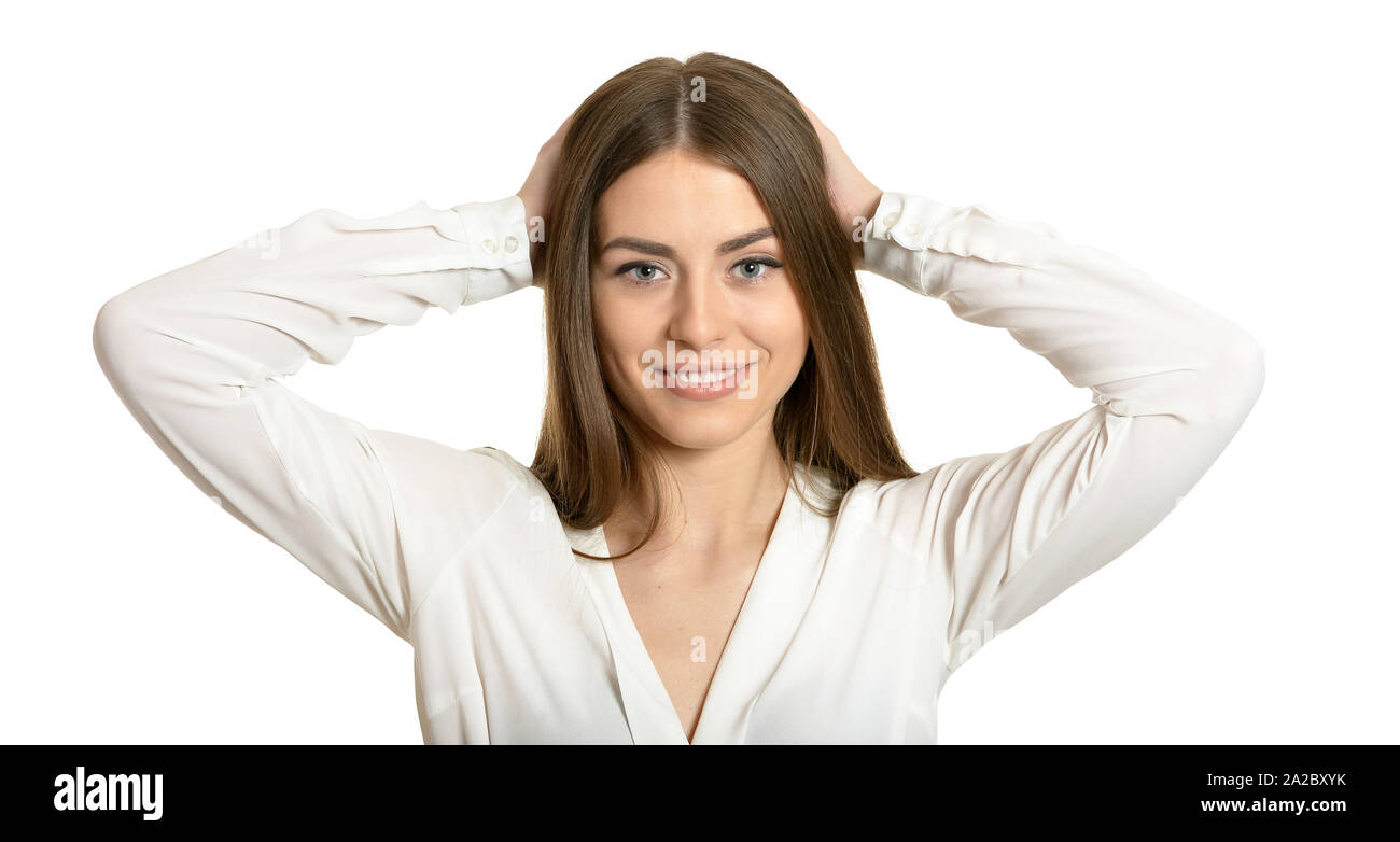 Portrait of brunette woman holding head in hands isolated Stock Photo ...