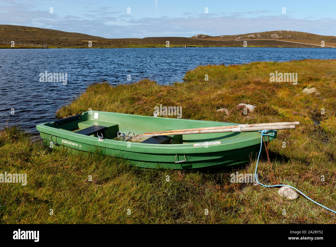 Pioner 12 rigid rowing boat for angling on the shore of Loch Na Gainimh in Wester Ross, Scotland. Stock Photo