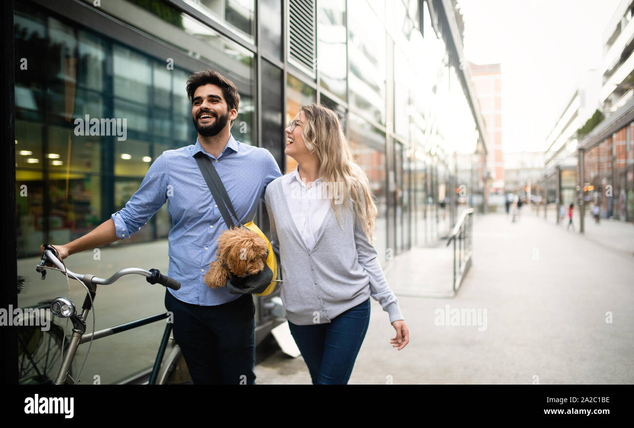 Couple in love with dog walking and smiling outdoor Stock Photo - Alamy