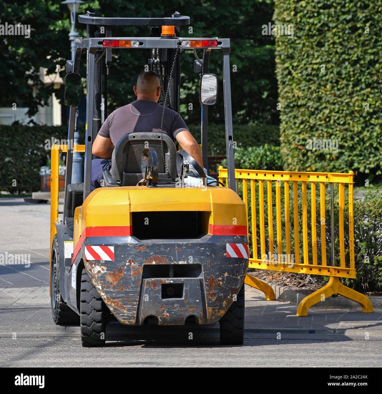Forklift at work on the city street Stock Photo Alamy