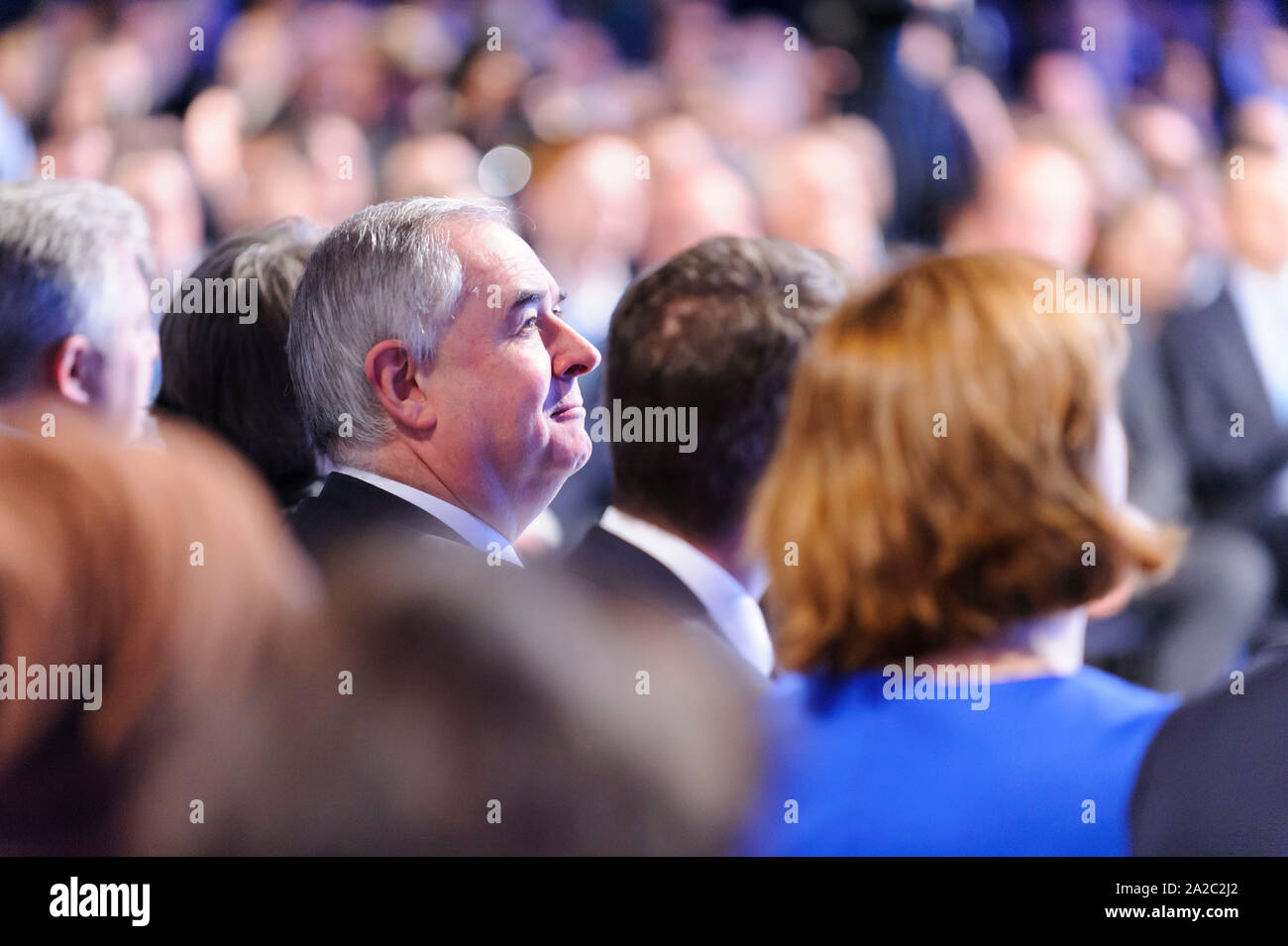 Manchester, UK. 2nd October 2019. Attorney General, The Rt Hon Geoffrey Cox QC MP, watches The Prime Minister, The Rt Hon Boris Johnson MP, deliver his keynote speech on day 4 of the 2019 Conservative Party Conference at Manchester Central. Credit: Paul Warburton/Alamy Live News Stock Photo