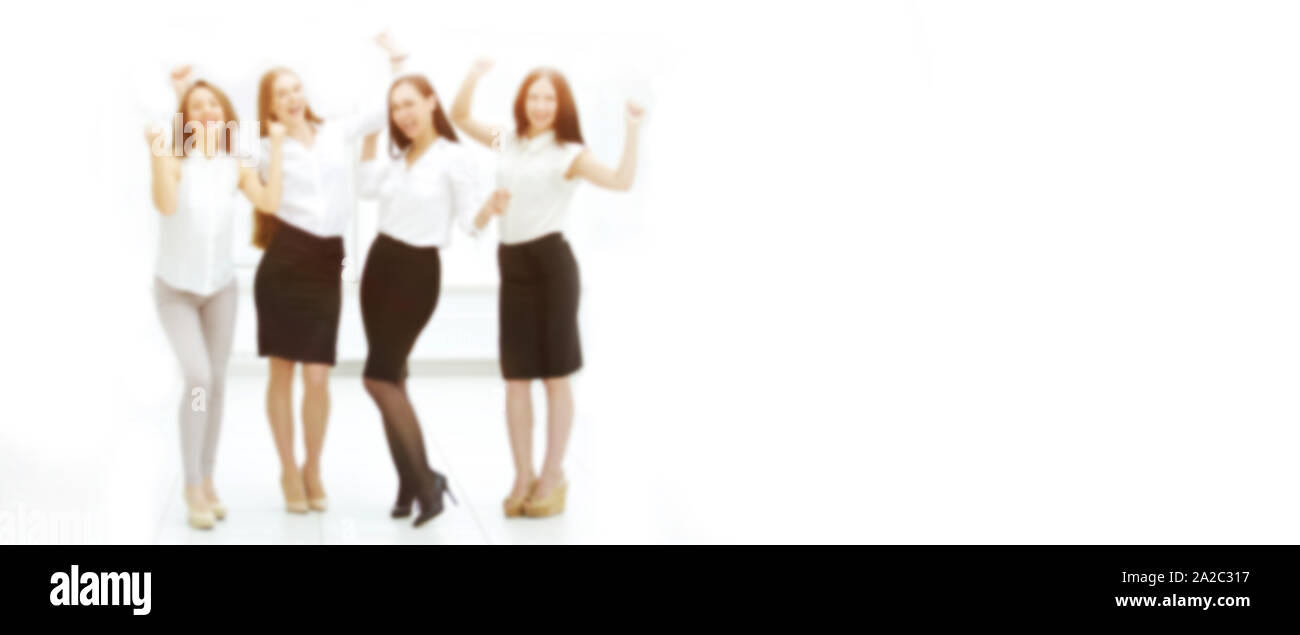 full-length portrait of the triumphant business team. blurred image for the advertising text. photo with copy space Stock Photo