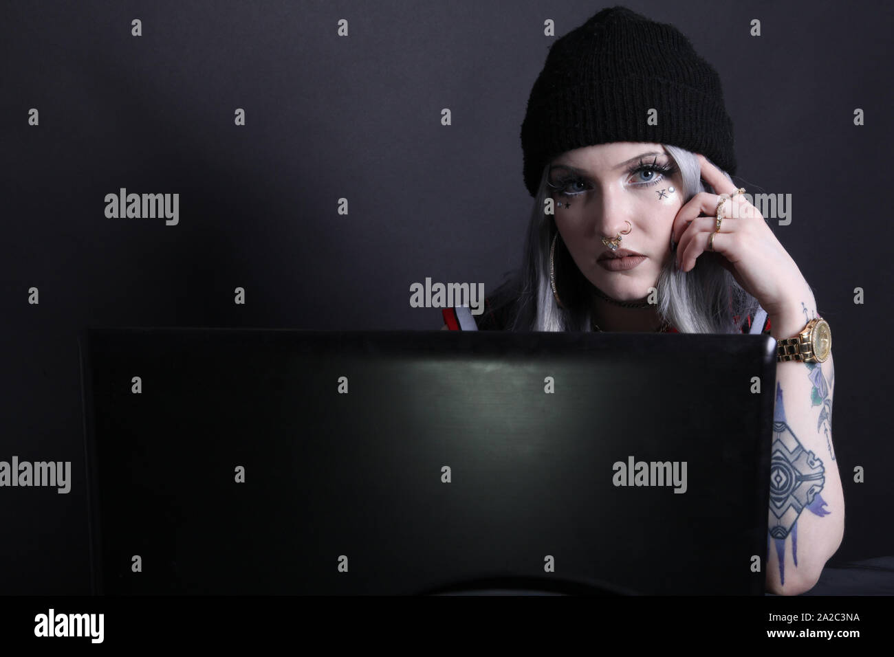 Woman Head Over Computer Screen Woman lit by laptop screen hi-res stock photography and images - Alamy