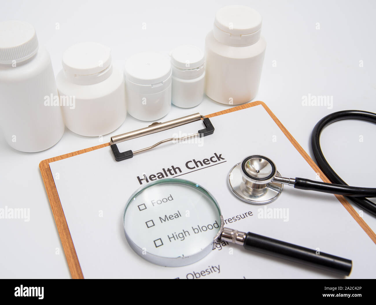 Health concept with clipboard and health check related items. Stock Photo
