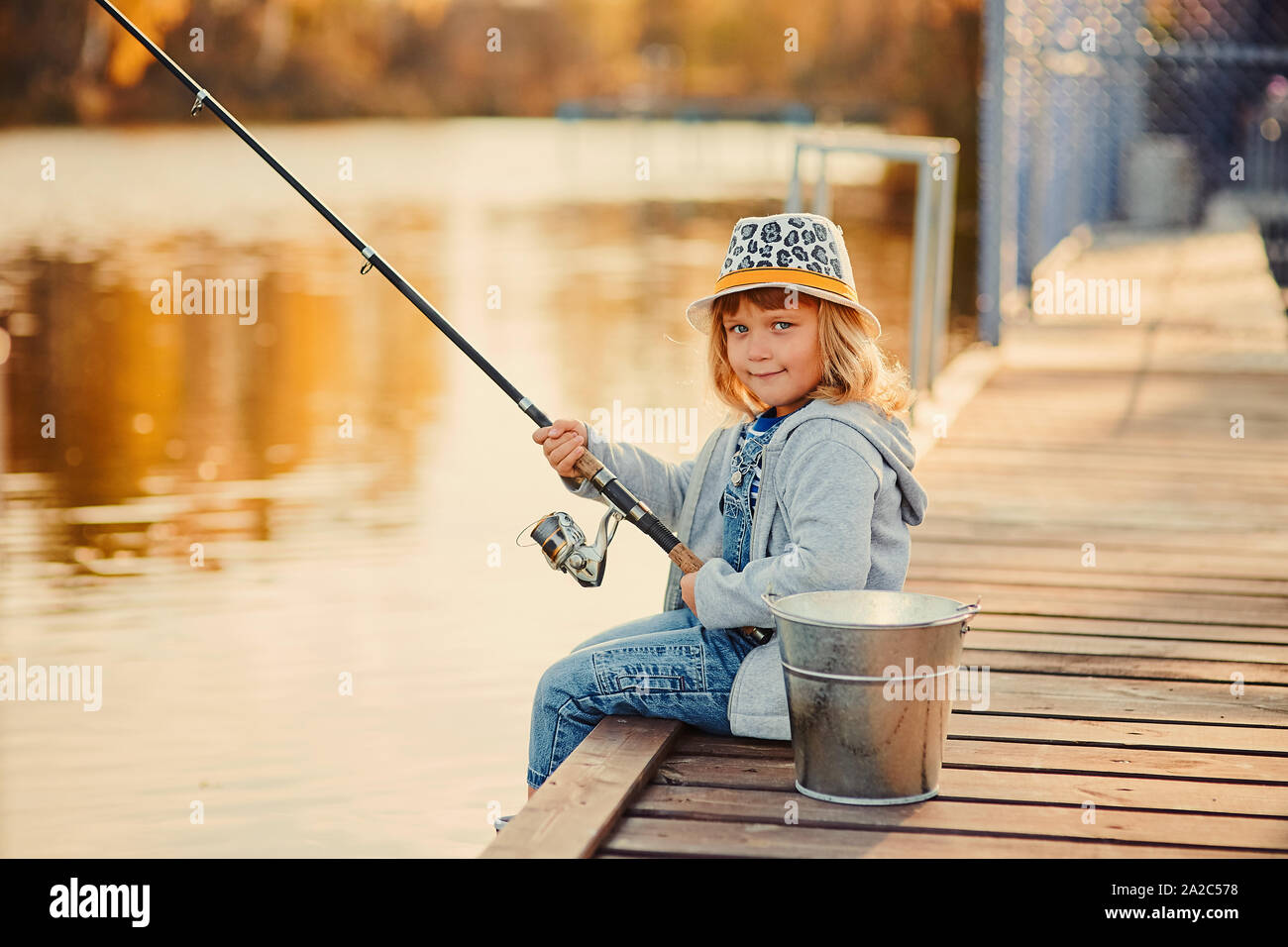 Young girl fish rod fish Cut Out Stock Images & Pictures - Alamy
