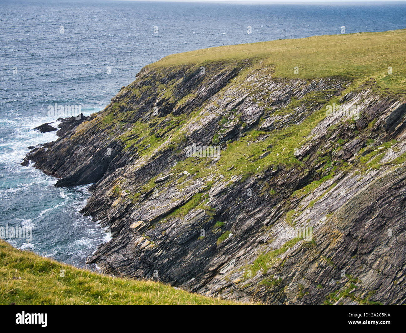 Eroded strata in sea cliffs on the west coast of St Ninian's Isle on the west coast of the south of Mainland Shetland. Stock Photo
