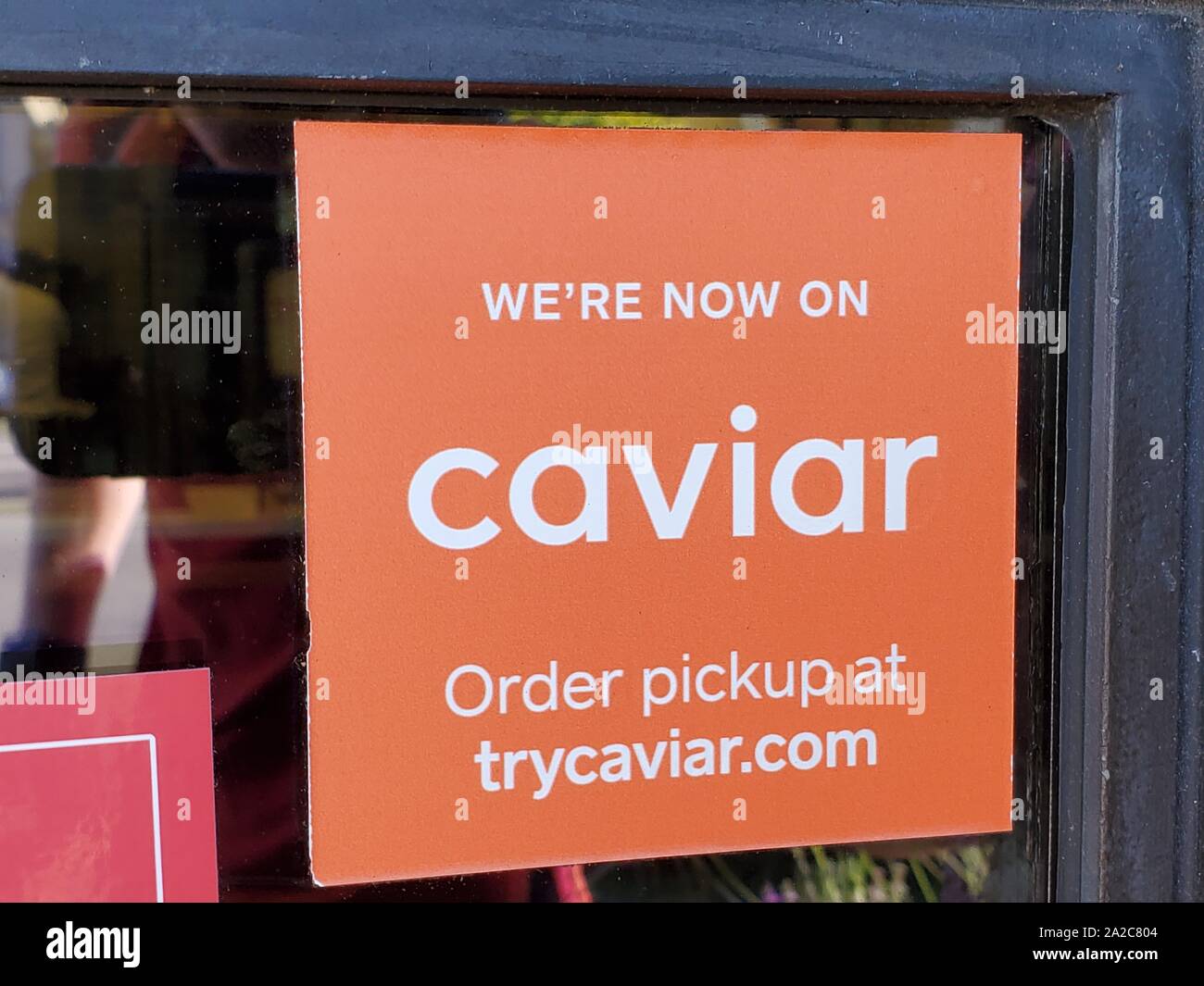 Close Up Of Logo For Food Delivery Technology Company Caviar At A