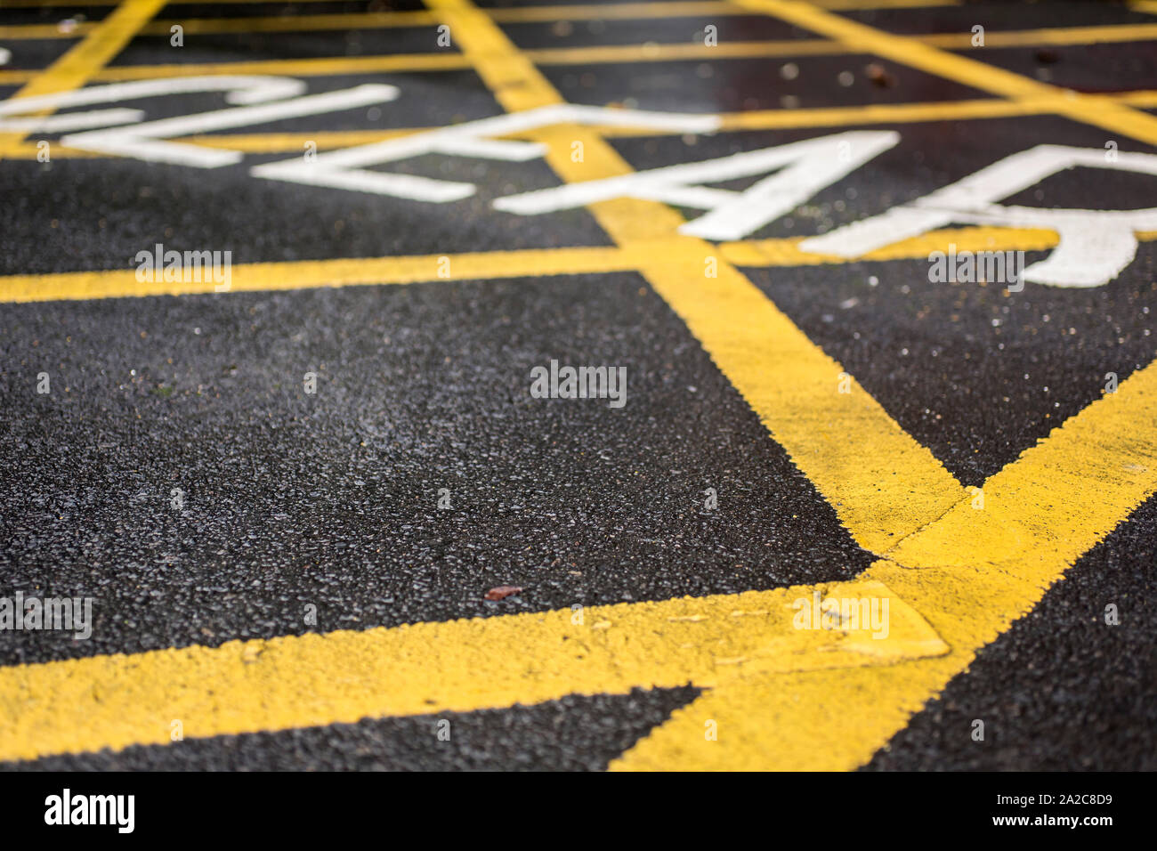 Yellow keep clear sign on road Stock Photo Alamy