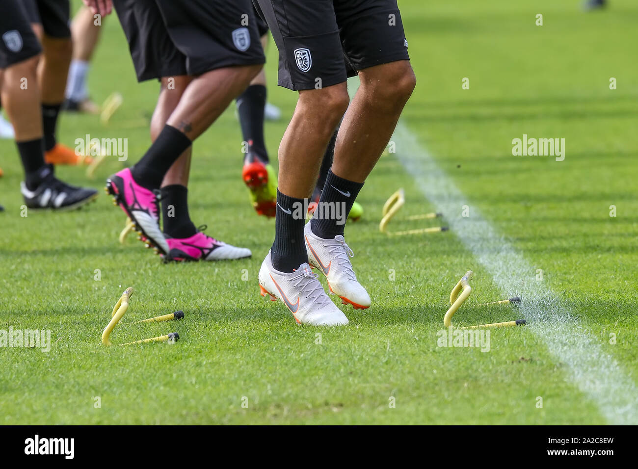 Horst, Netherlands - June 27, 2018: The feet of PAOK players and football  training equipment during the training of the team on the pitch Stock Photo  - Alamy