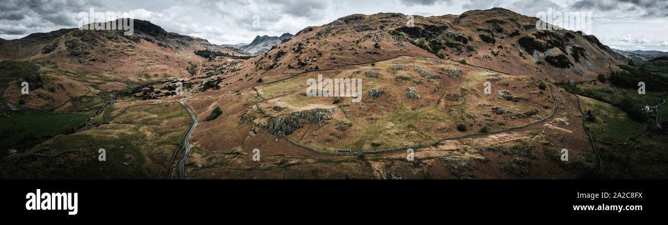 Aerial view looking over hills and fens towards mountains in the Lake district Stock Photo