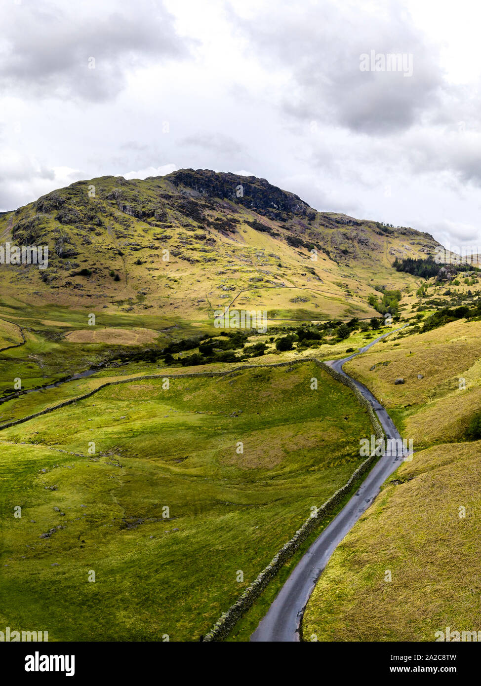 Aerial view looking over hills and fens towards mountains in the Lake district Stock Photo