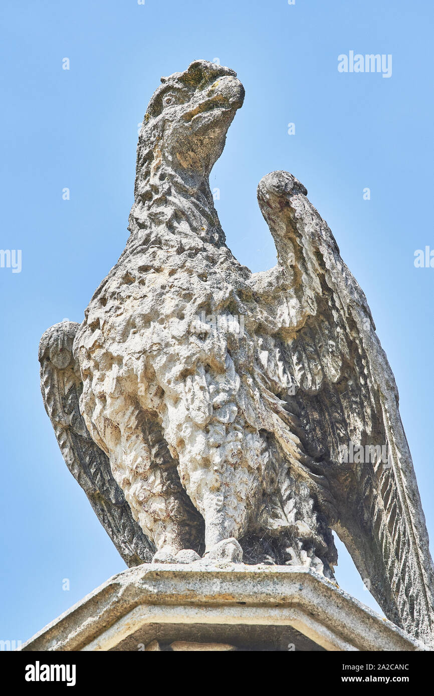 Stone statue of an eagle on the roof of New Court at the college of St John, university of Cambridge, England. Stock Photo