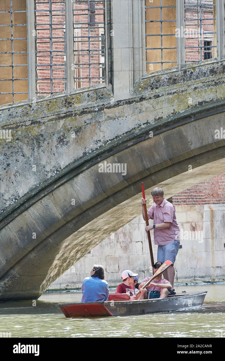 Punting along the river Cam under the bridge of Sighs at the college of St John, university of Cambridge, England. Stock Photo